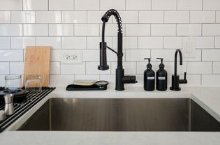 kitchen sink with white subway tiles