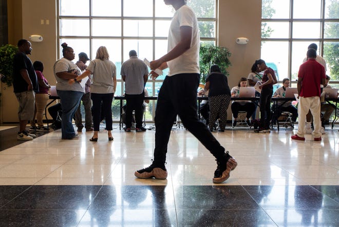 Detroit residents hoping to secure autoworker jobs attend a job fair the city of Detroit hosted for the Fiat Chrysler expansion on the city's east side at Second Ebenezer Church in Detroit on Thursday, Aug. 8, 2019.