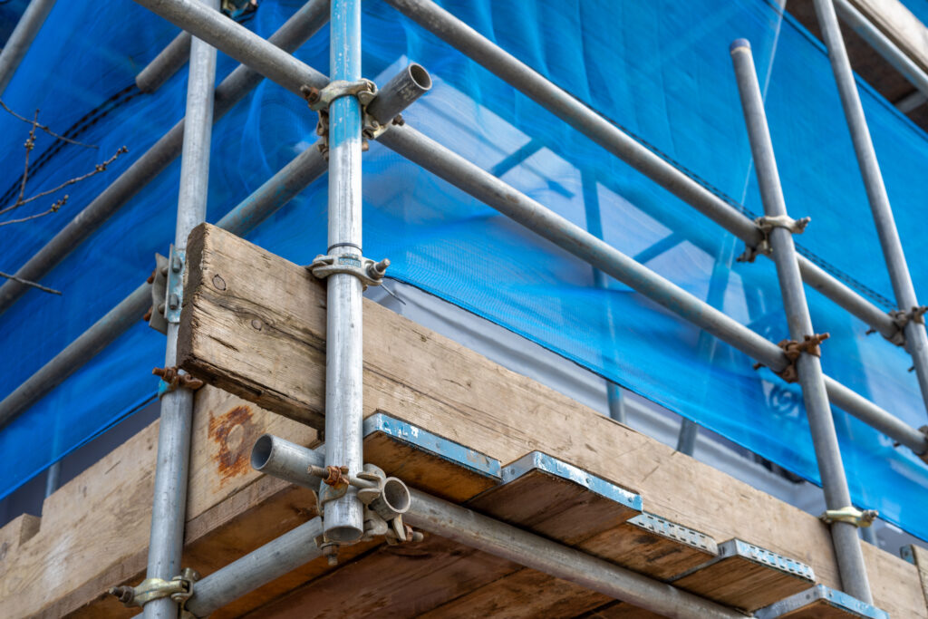 Picture of up close scaffolding with blue screen